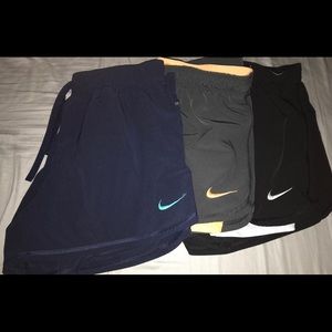 THREE pairs Nike wicking running shorts